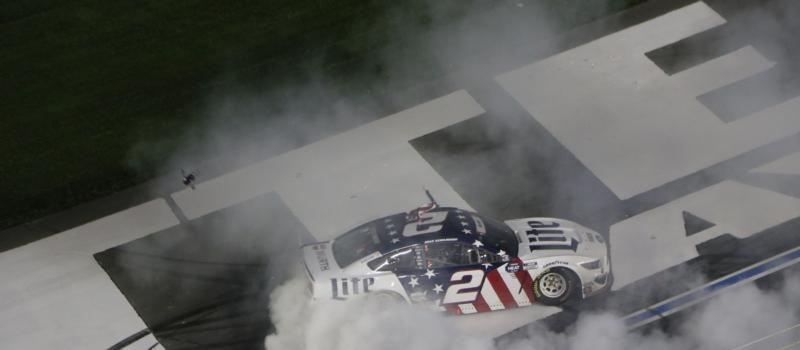 Brad Keselowski celebrates with a burnout after winning the first Coca-Cola 600 of his career.