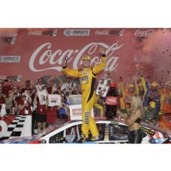 Kyle Busch celebrates after winning Sunday’s Coca-Cola 600 at Charlotte Motor Speedway, Busch's first points-paying victory at Charlotte in NASCAR's premier series.