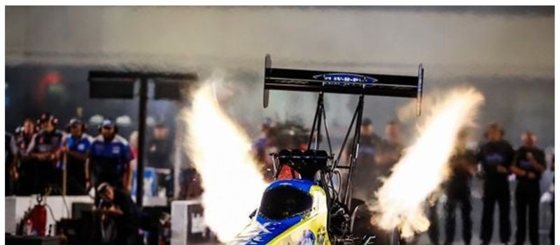 Brittany Force powers her 11,000-horsepower Top Fuel dragster off the starting line during last year's Night of Fire event at zMAX Dragway.