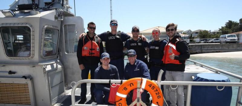 Coca-Cola Racing Family driver Daniel Suarez, top right, visited U.S. Coast Guard Station Wrightsville Beach Tuesday on a Mission 600 tour alongside Travis Mack (top left), his Trackhouse Racing crew chief.