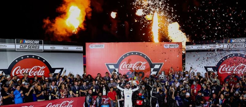 Ross Chastain celebrates after winning Sunday's Coca-Cola 600 NASCAR Cup Series race at Charlotte Motor Speedway.