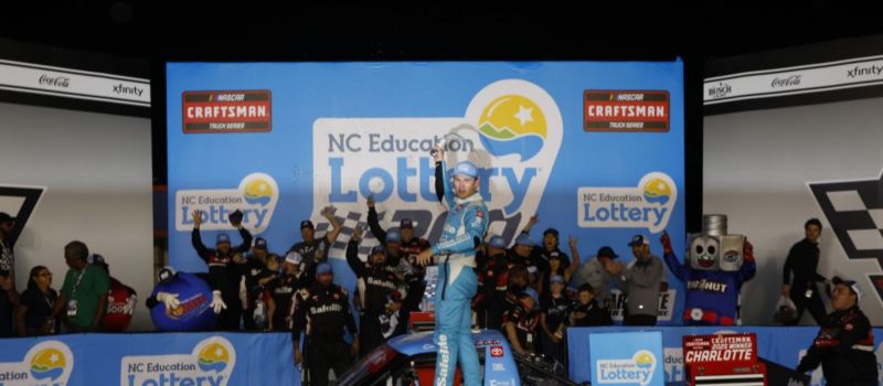 Corey Heim celebrates after winning Friday's NASCAR CRAFTSMAN Truck Series NC Education Lottery 200 at Charlotte Motor Speedway.