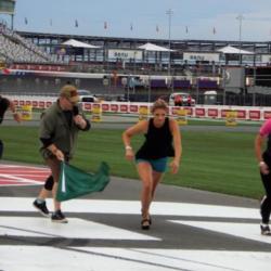 NHRA Pro Stock Motorcycle racer Angie Smith, right, competed in and won a High Heel Dash race on Ladies' Night during Tuesday's Bojangles' Summer Shootout at Charlotte Motor Speedway.