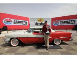 H.A. Mergen poses beside his 1955 Oldsmobile Starfire after winning the Walt Hollifield Best of Show award on Sunday at the Pennzoil AutoFair presented by Advance Auto Parts at Charlotte Motor Speedway