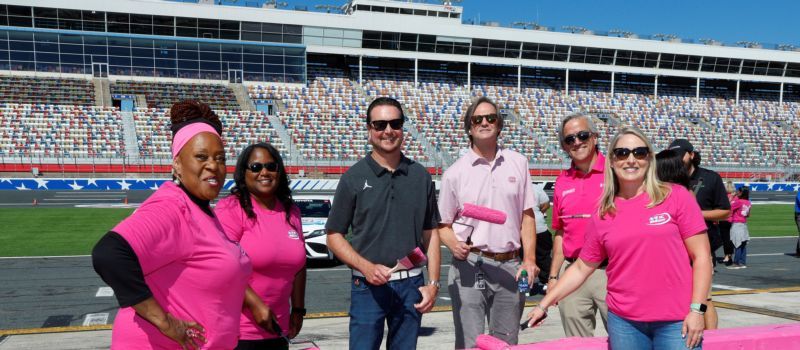 NASCAR Cup Series driver Kurt Busch (center) joined Blue Cross NC, Charlotte Motor Speedway and breast cancer survivors to paint pit road wall pink ahead of National Breast Cancer Awareness Month and the Oct. 8 Drive for the Cure 250 presented by Blue Cross and Blue Shield of North Carolina.