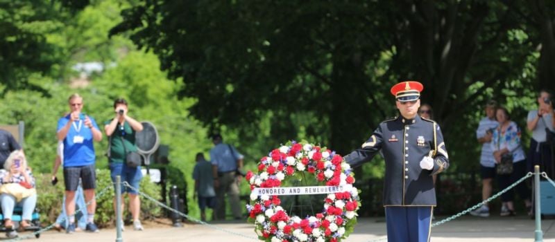 A member of the Old Guard stands near a wreath presented by Charlotte Motor Speedway and defending Coca-Cola 600 winner Christopher Bell as part of Mission 600, a prelude to the military salute to the U.S. Armed Forces ahead of the Coca-Cola 600 on Memorial Day weekend